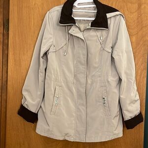 Women’s George lightweight rain repellent jacket with removable hood.  Zip/snaps